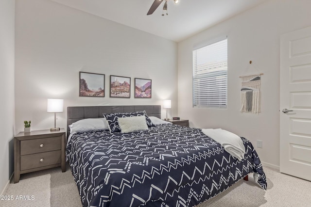 carpeted bedroom with baseboards and a ceiling fan