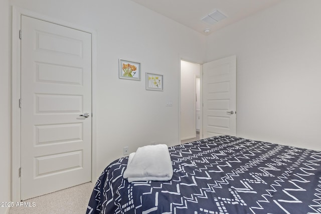 carpeted bedroom with visible vents