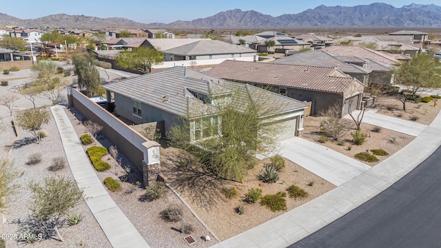 aerial view featuring a mountain view and a residential view