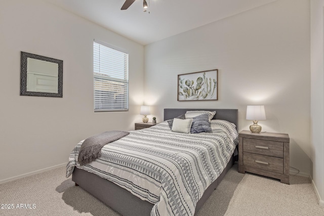 bedroom featuring baseboards, ceiling fan, and carpet flooring