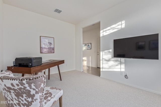 office space with visible vents, carpet floors, and baseboards