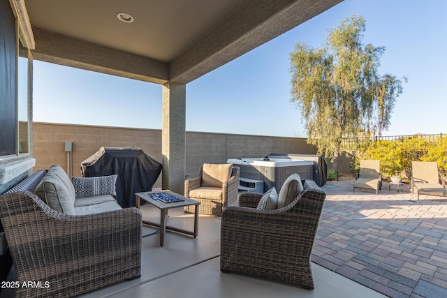 view of patio featuring grilling area, an outdoor living space with a fire pit, and a fenced backyard