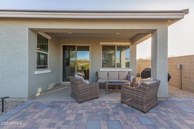 view of patio / terrace featuring outdoor lounge area and fence