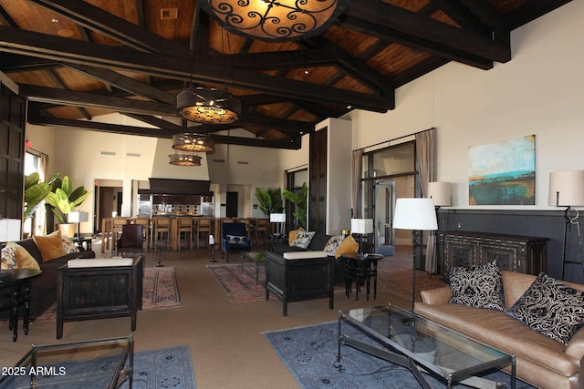 living room with wood ceiling, beamed ceiling, and high vaulted ceiling