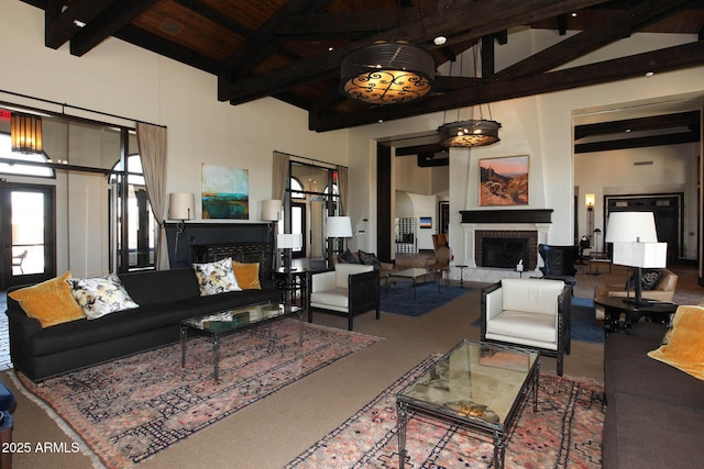 living room with wooden ceiling, beamed ceiling, a fireplace, and high vaulted ceiling