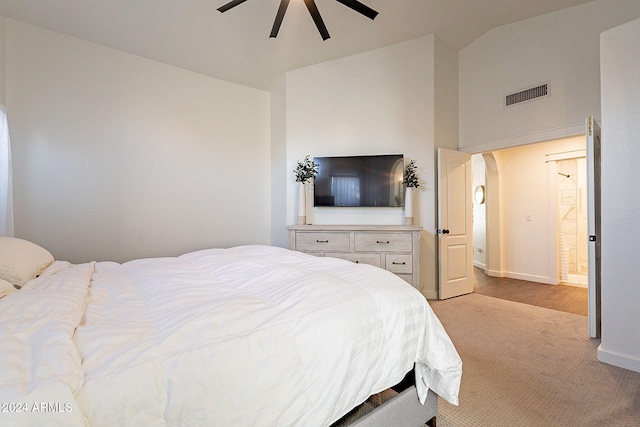 carpeted bedroom featuring ceiling fan and lofted ceiling