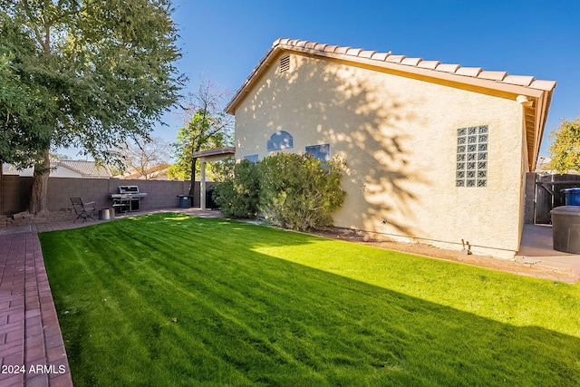 rear view of house with a yard