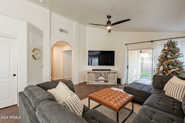 living room with ceiling fan, dark hardwood / wood-style flooring, and lofted ceiling