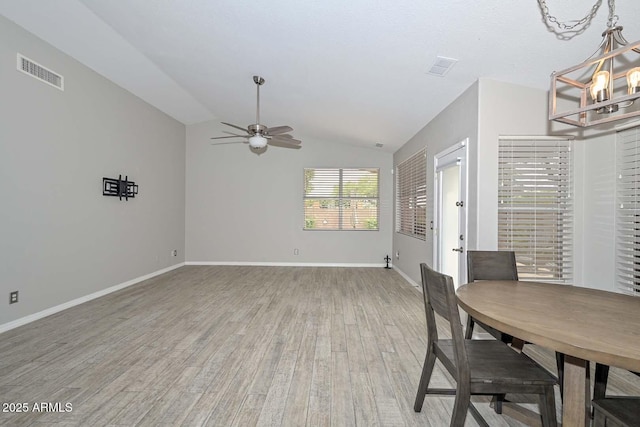 7949 W Wescott Dr, Glendale, AZ 85308 - dining area with a chandelier, light wood-style floors, lofted ceiling, ceiling fan, and baseboards