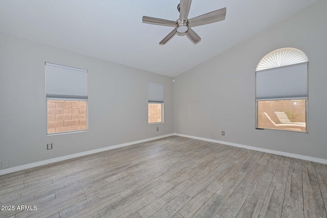 7949 W Wescott Dr, Glendale, AZ 85308 - unfurnished room featuring ceiling fan, wood finished floors, vaulted ceiling, and baseboards