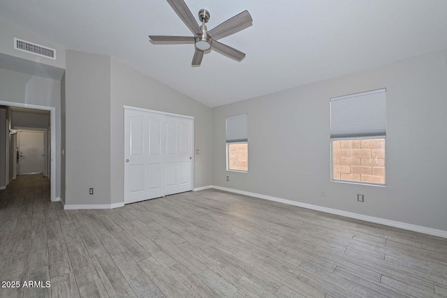 7949 W Wescott Dr, Glendale, AZ 85308 - unfurnished bedroom with vaulted ceiling, wood finished floors, baseboards, a closet, and ceiling fan