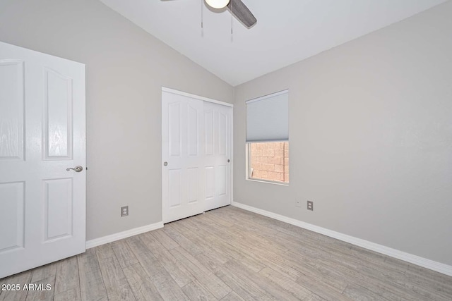 7949 W Wescott Dr, Glendale, AZ 85308 - unfurnished bedroom featuring lofted ceiling, wood finished floors, baseboards, a closet, and ceiling fan