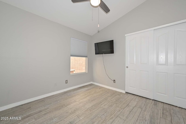 7949 W Wescott Dr, Glendale, AZ 85308 - unfurnished bedroom featuring wood finished floors, lofted ceiling, baseboards, a closet, and ceiling fan