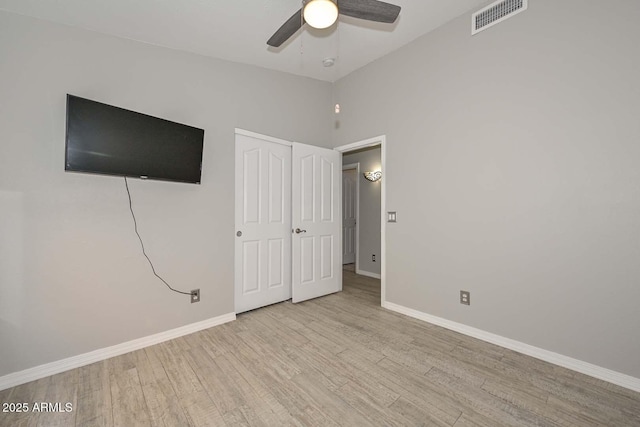 7949 W Wescott Dr, Glendale, AZ 85308 - unfurnished bedroom with wood finished floors, baseboards, a ceiling fan, and a closet