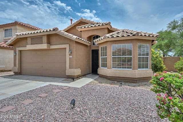 7949 W Wescott Dr, Glendale, AZ 85308 - mediterranean / spanish home with a garage, stucco siding, driveway, and a tile roof