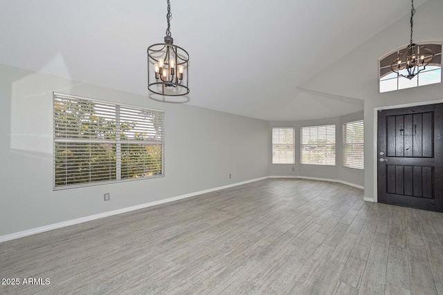 7949 W Wescott Dr, Glendale, AZ 85308 - foyer featuring a chandelier, plenty of natural light, and wood finished floors