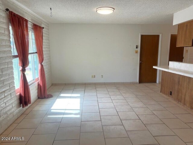904 E Christmas Tree Ln, Pearce, AZ 85625 - unfurnished dining area featuring a textured ceiling