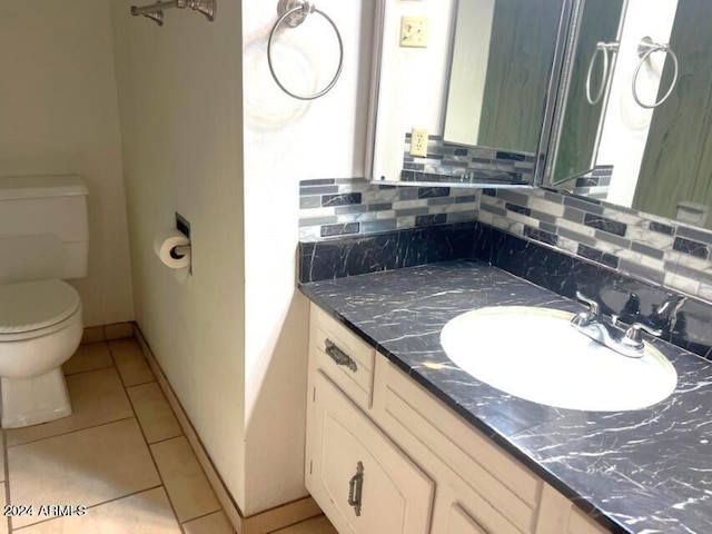904 E Christmas Tree Ln, Pearce, AZ 85625 - bathroom featuring toilet, tile patterned flooring, backsplash, and vanity