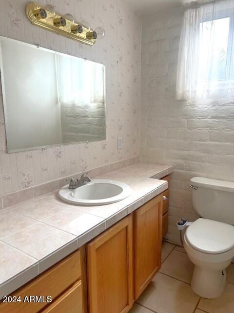 904 E Christmas Tree Ln, Pearce, AZ 85625 - bathroom with wallpapered walls, toilet, vanity, and tile patterned flooring