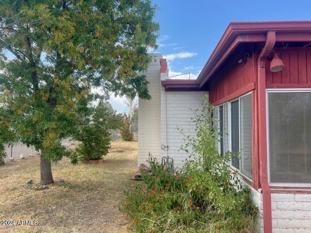 904 E Christmas Tree Ln, Pearce, AZ 85625 - view of home's exterior featuring a chimney