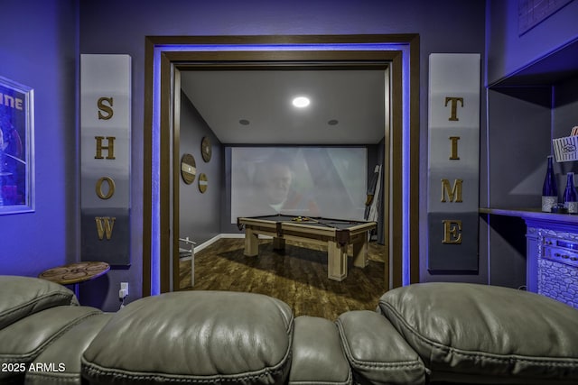 cinema room with baseboards, billiards, and wood finished floors