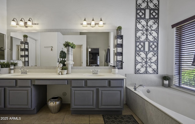 bathroom with tile patterned flooring, double vanity, a sink, and a bath