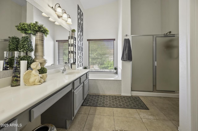 full bath with tile patterned floors, a shower stall, a bath, and vanity