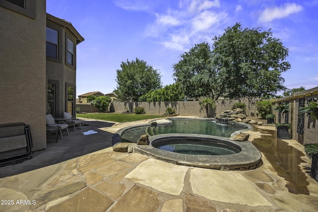 view of swimming pool with a patio, an in ground hot tub, a fenced in pool, and a fenced backyard