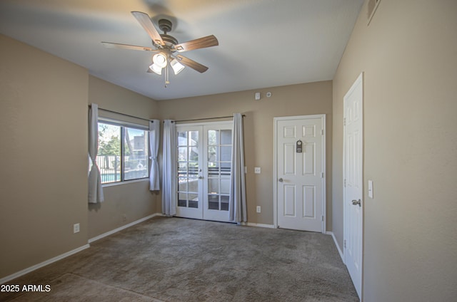 spare room with ceiling fan, baseboards, carpet flooring, and french doors