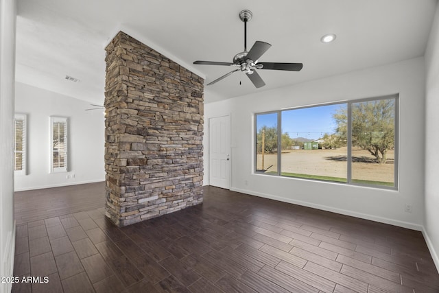 unfurnished living room featuring ceiling fan and lofted ceiling