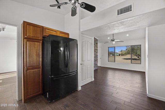 kitchen featuring black refrigerator and ceiling fan