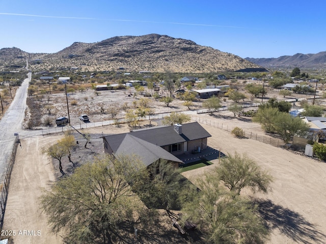 birds eye view of property with a mountain view