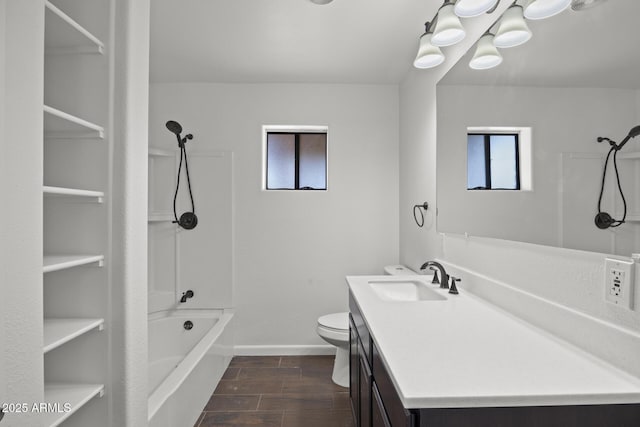 full bathroom featuring vanity, bathing tub / shower combination, and toilet