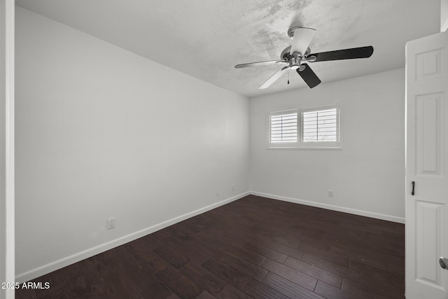 empty room featuring a textured ceiling, dark hardwood / wood-style flooring, and ceiling fan