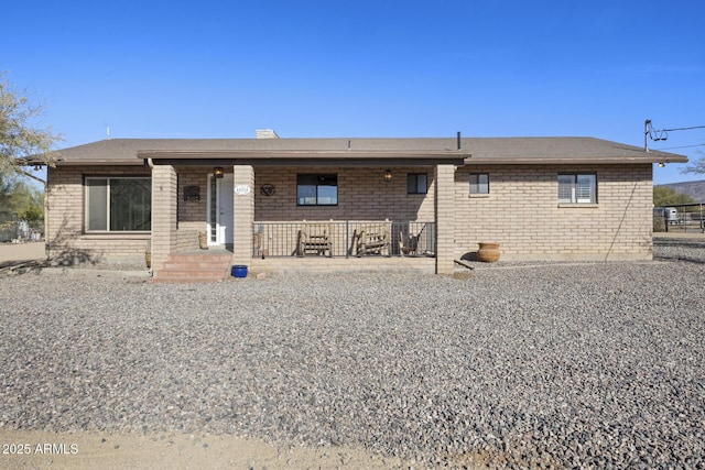 back of property featuring a porch