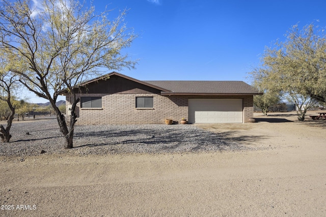 single story home with a garage