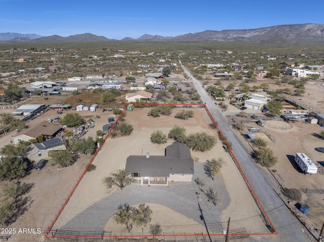 birds eye view of property with a mountain view