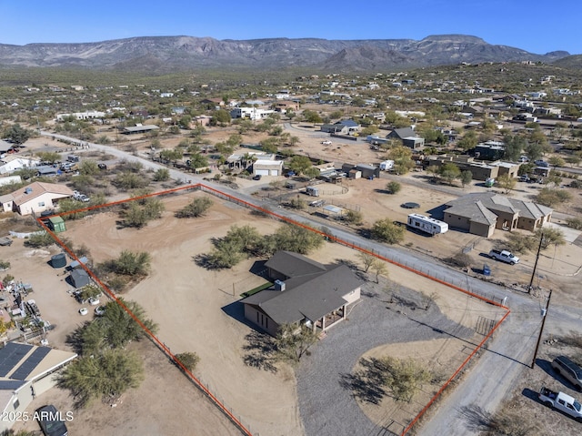 birds eye view of property featuring a mountain view