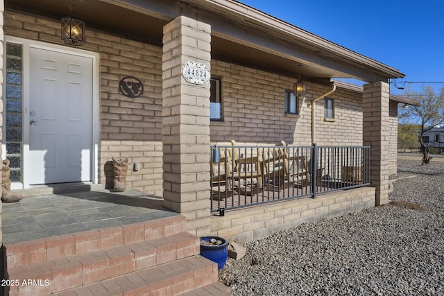 doorway to property with covered porch