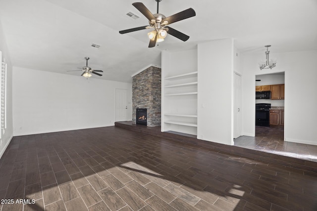 unfurnished living room with a stone fireplace, built in features, ceiling fan with notable chandelier, and lofted ceiling