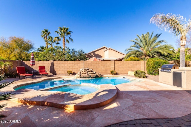 view of swimming pool with an in ground hot tub, grilling area, area for grilling, and a patio area