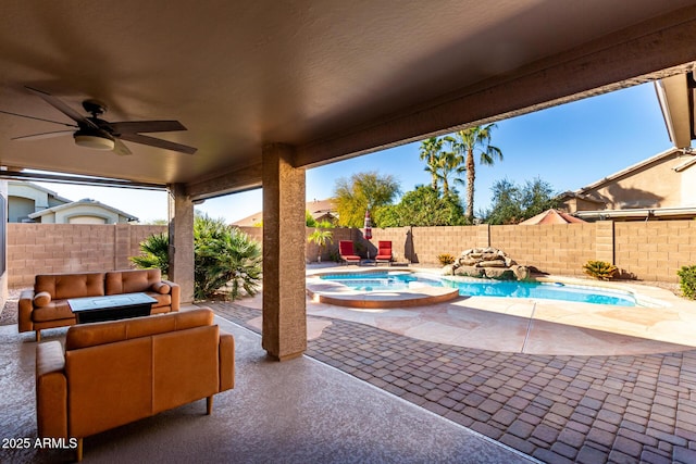 view of patio with a swimming pool with hot tub, outdoor lounge area, and ceiling fan