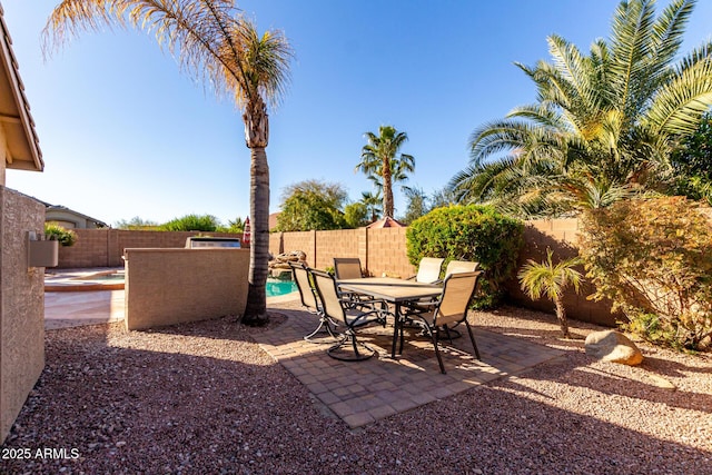 view of patio / terrace with a fenced in pool