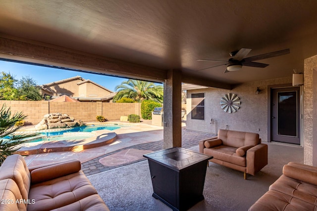 view of patio / terrace with a fenced in pool, outdoor lounge area, and ceiling fan