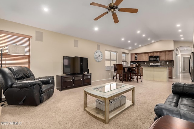 living room with vaulted ceiling and ceiling fan