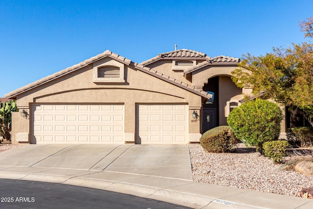 view of front of property with a garage