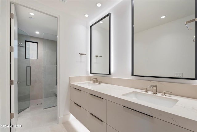 6921 N Joshua Tree Ct, Paradise Valley, AZ 85253 - bathroom with double vanity, a stall shower, recessed lighting, and tile patterned flooring