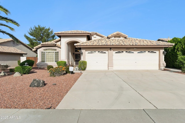 mediterranean / spanish-style home featuring a garage