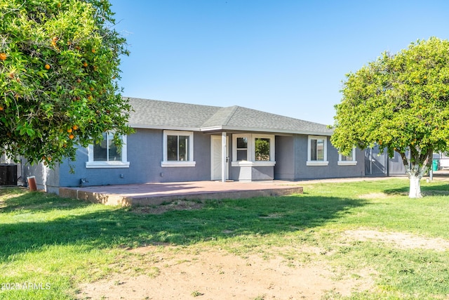 17824 E Chestnut Dr, Queen Creek, AZ 85142 - back of property with a lawn and roof with shingles