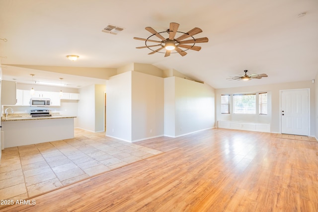 17824 E Chestnut Dr, Queen Creek, AZ 85142 - unfurnished living room with light wood-style flooring, a sink, visible vents, lofted ceiling, and a ceiling fan